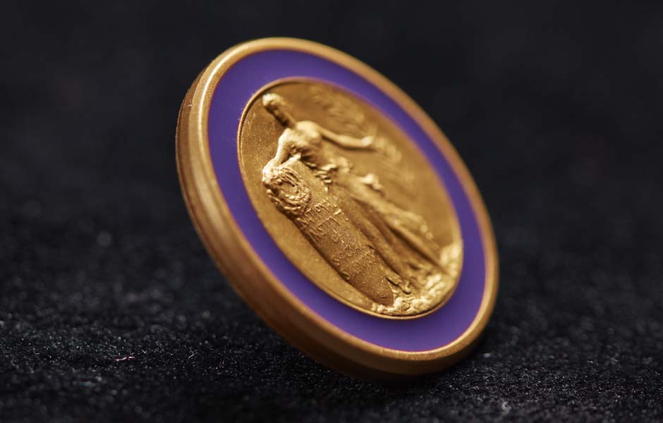 Brass lapel pin with purple enamel