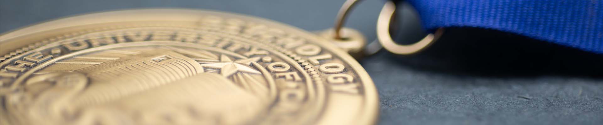 Brass Medal on Blue Neck Ribbon