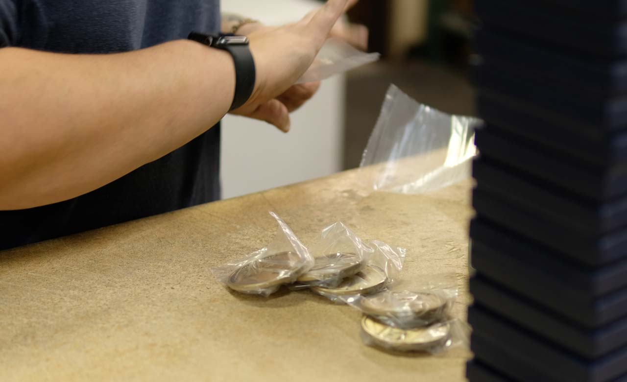 Medallions Being Bagged and Boxed