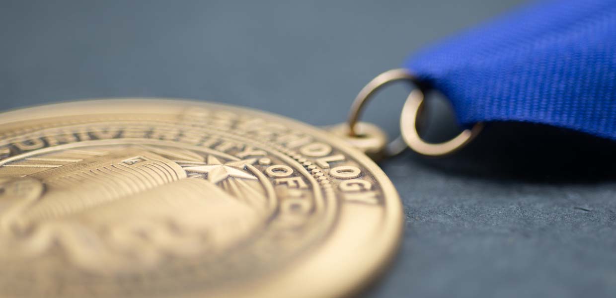 Brass Medal on Blue Neck Ribbon